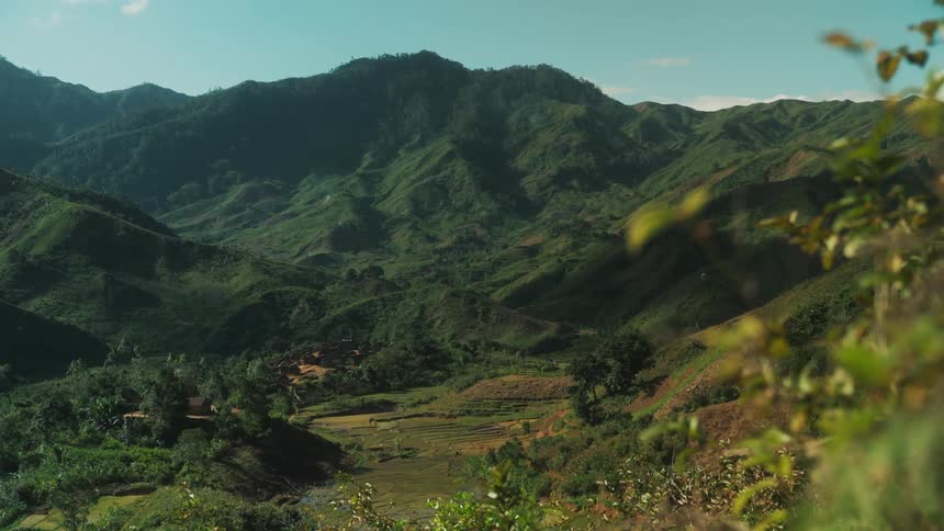 Serene valley in the mountains under a blue sky