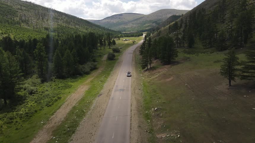 The car travels down the road alone