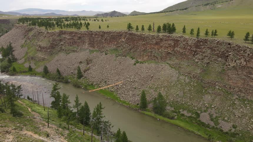 A clip of a river closer to an open field