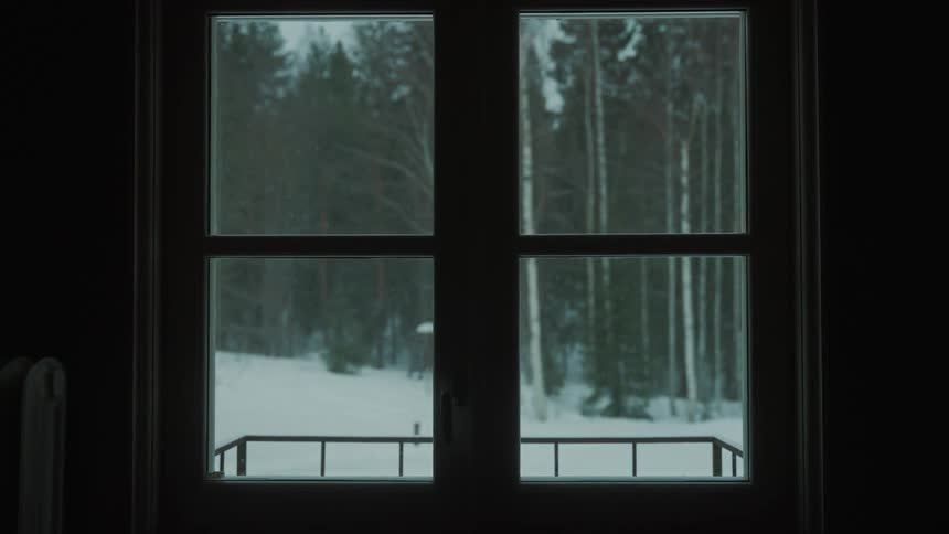 A window with a view of the snow outside