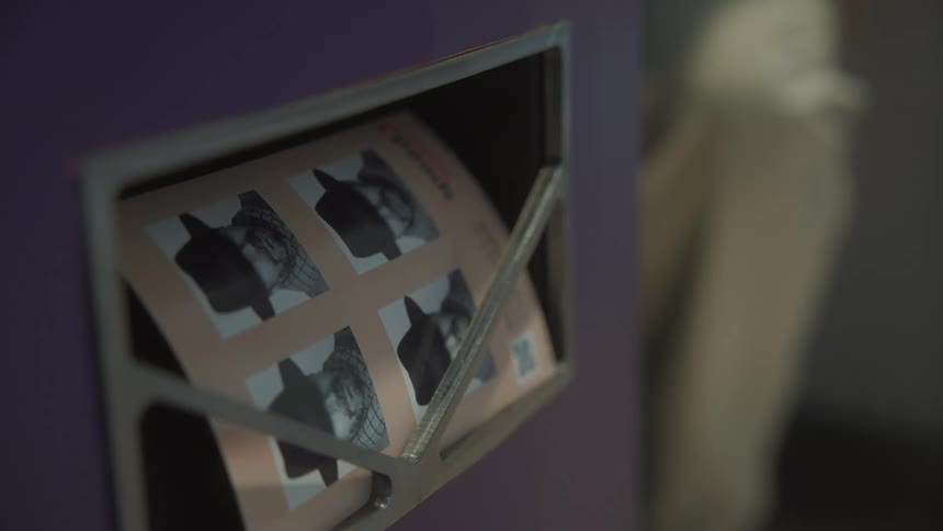 A photo dispensed by a photobooth