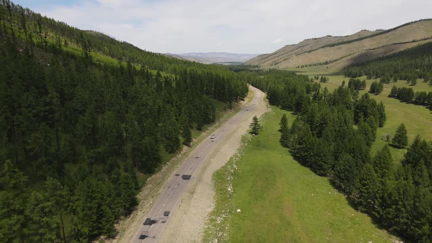 An aerial view of a vast mountainous woods