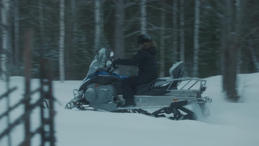 A group of people riding in the snow