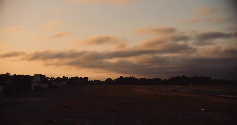 Aerial view of a rural airfield at sunset
