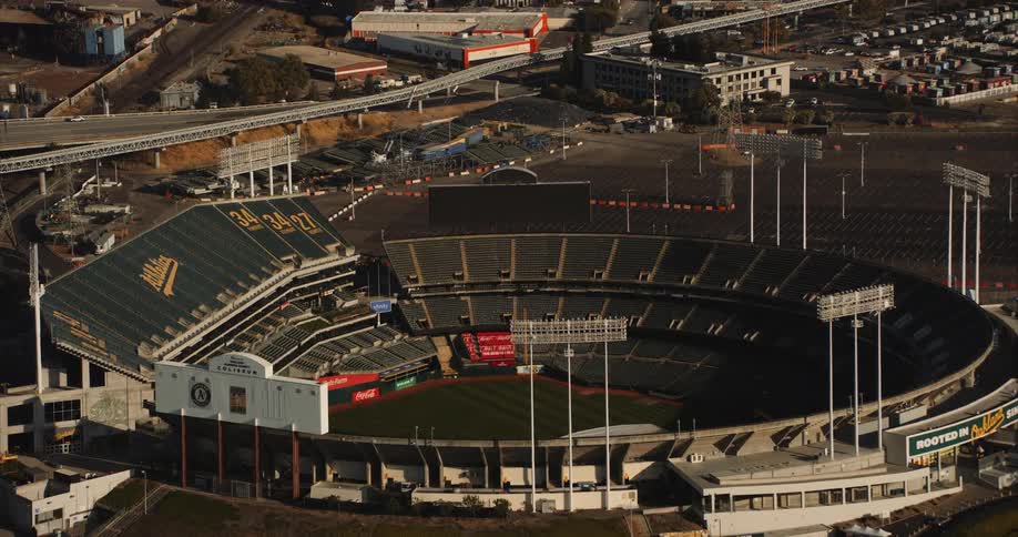 Skyline of a baseball stadium in the city during the day, the Oakland Coliseum
