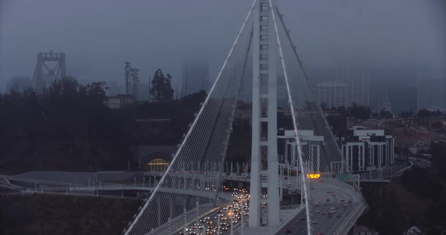 The Oakland Bay Bridge and San Francisco in twilight fog