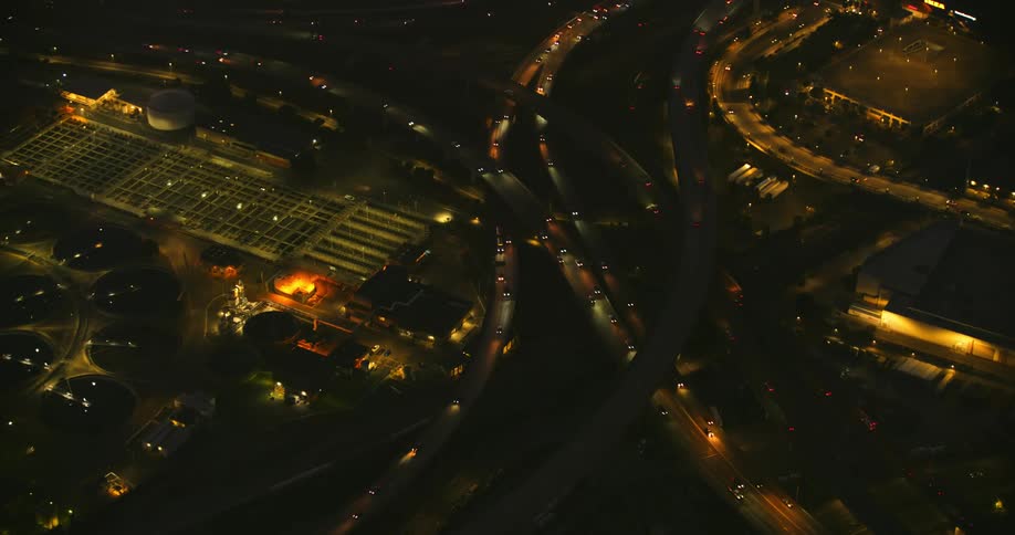 Aerial view of cars driving on the highway at night, the Oakland Maze