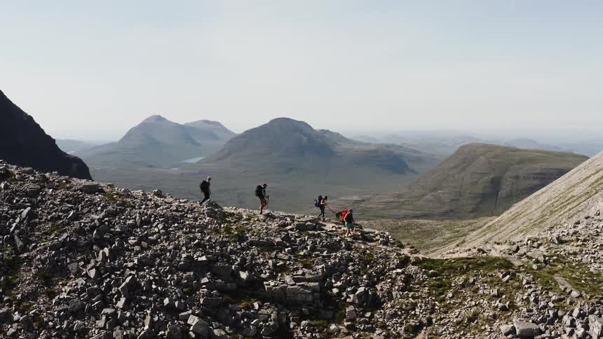 A clip of people hiking a rocky mountain
