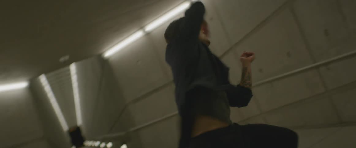 Man doing spinning dance move in a building