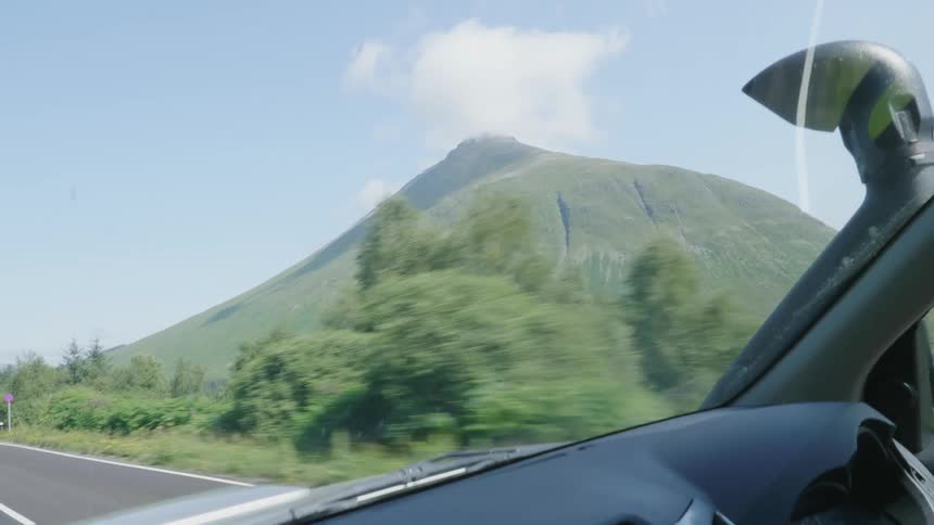 Mountain peak seen from a moving vehicle