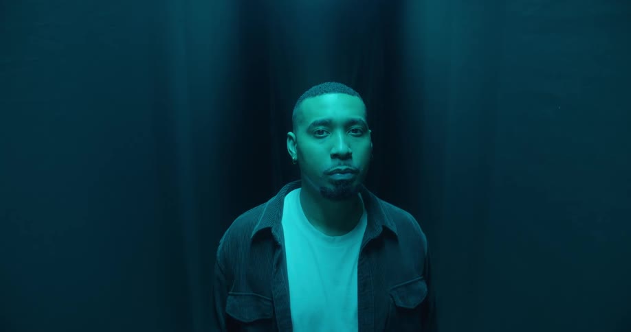 Closeup of a mans face in a dark room