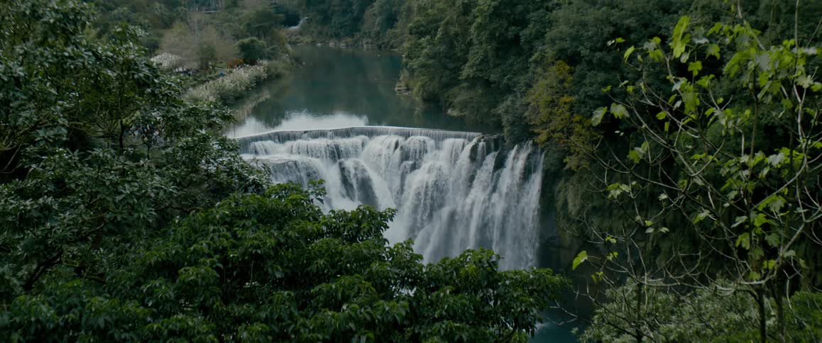 Large river ends on a waterfall in the jungle