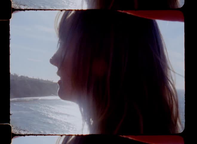 Closeup of a womans face admiring the beach landscape