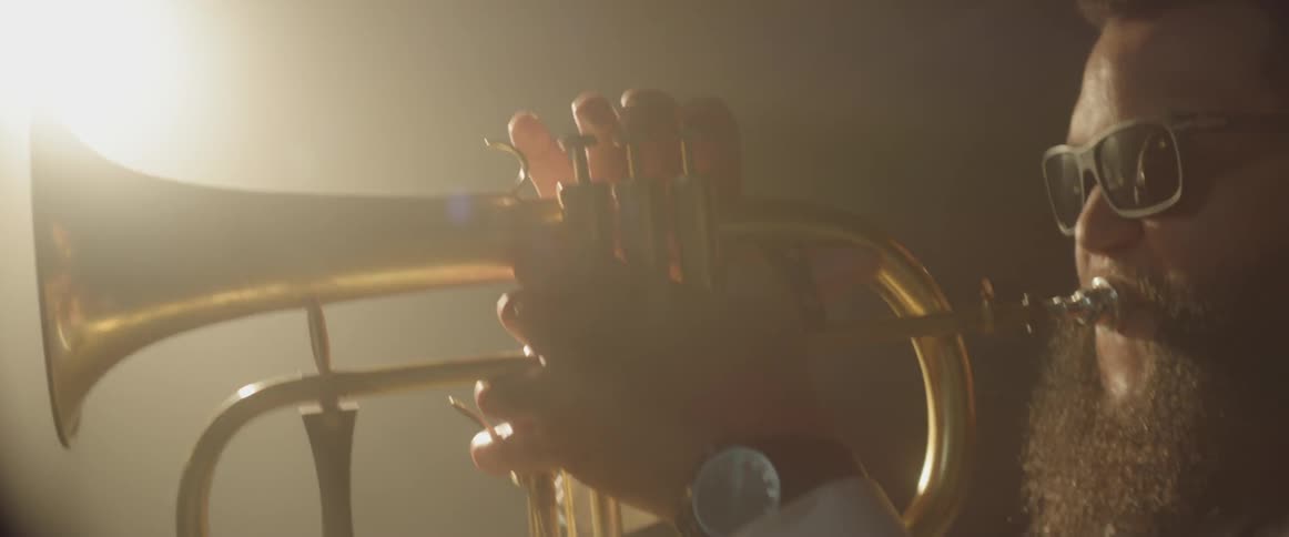 A trumpeter plays his instrument