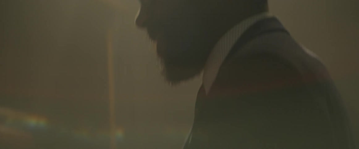 A black jazz pianist is singing and playing piano