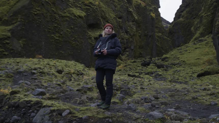 Photographer takes pictures of the wilderness in the mountains