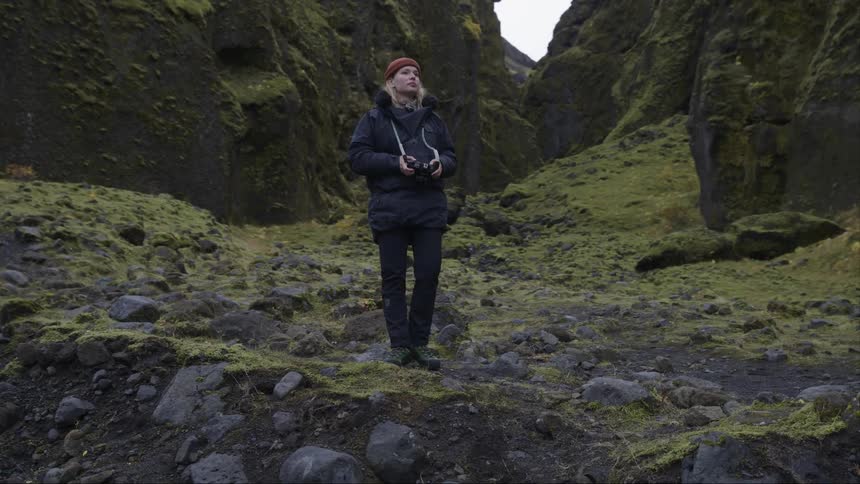 A clip of a female photographer taking some pictures