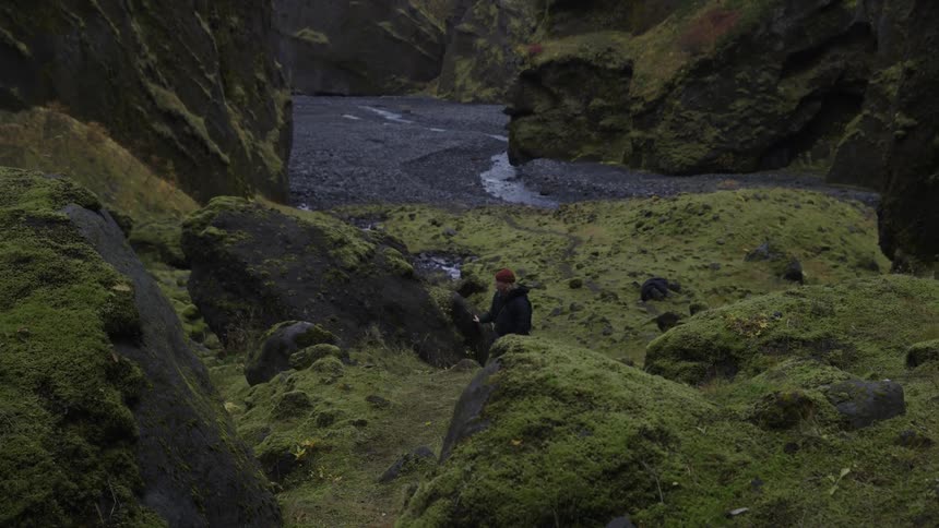 A clip of a female photographer hiking