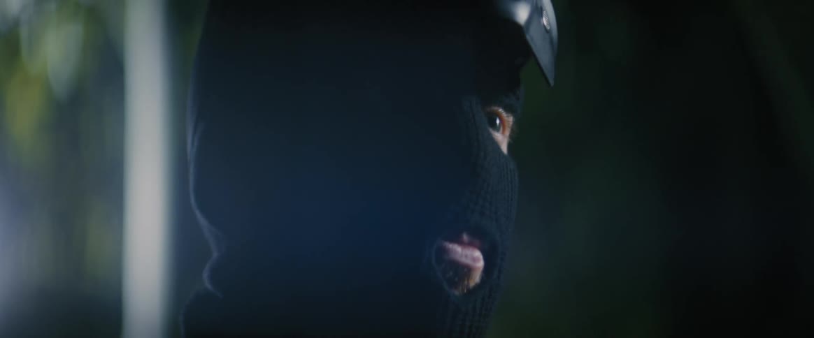 Man puts on a fullface helmet with a reflective visor
