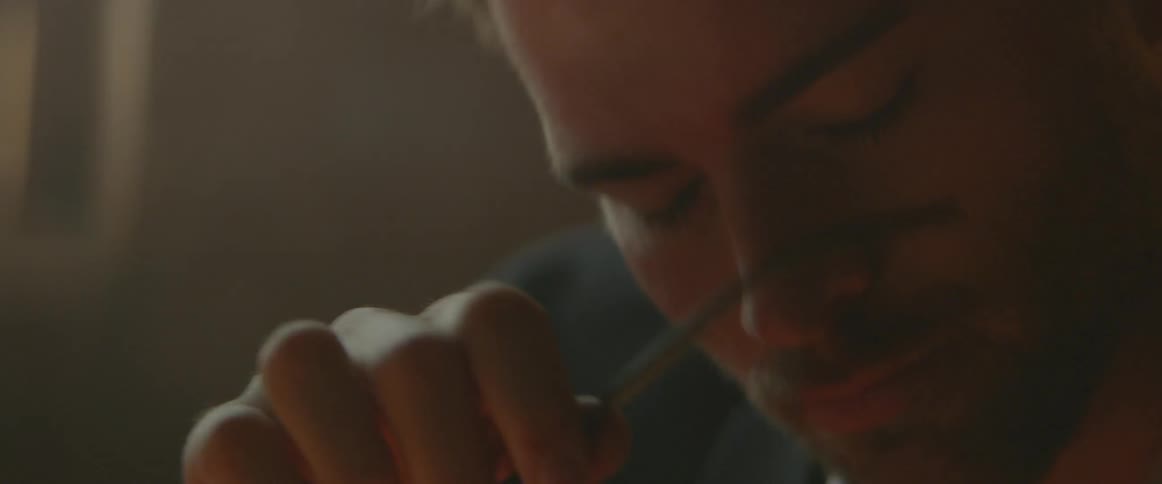Man takes his glasses off and rubs his eyes