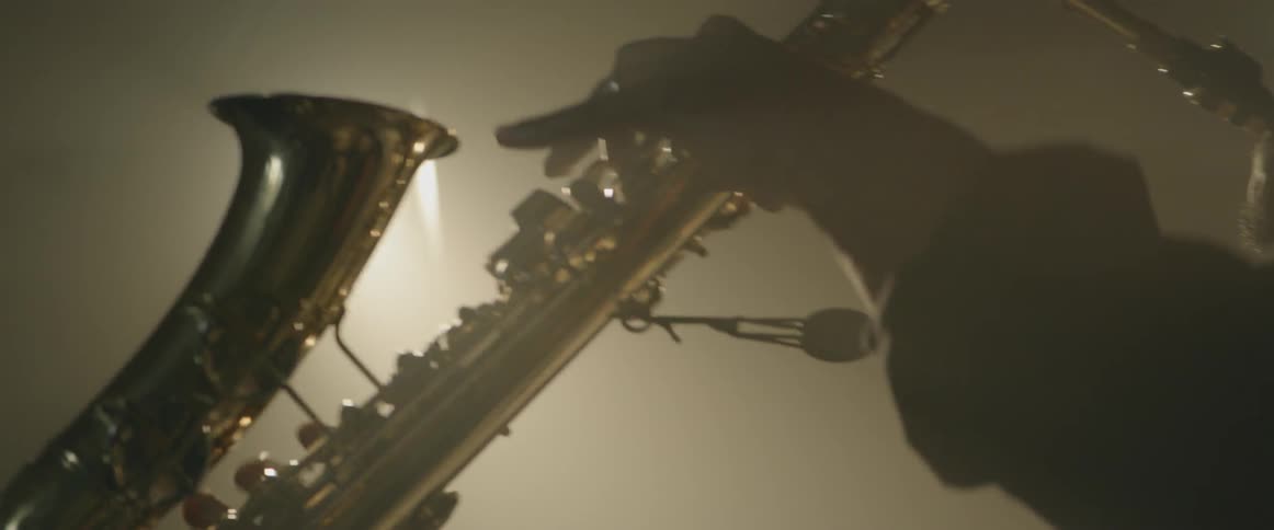 A saxophone musician plays his instrument