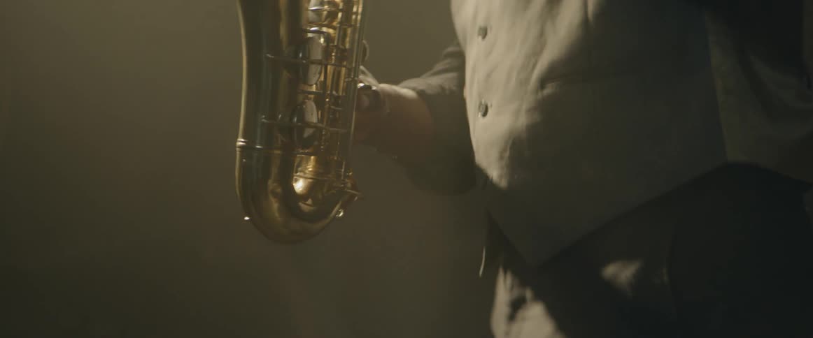 A saxophone musician plays his instrument