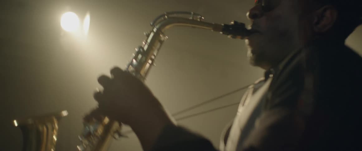 A saxophone musician plays his instrument