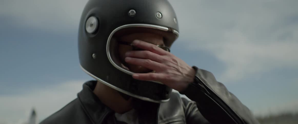 Man in bike helmet and sunglasses  points