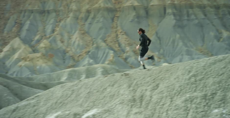 A man is running on the hills