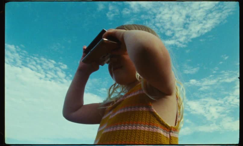 A child taking a picture with a camera