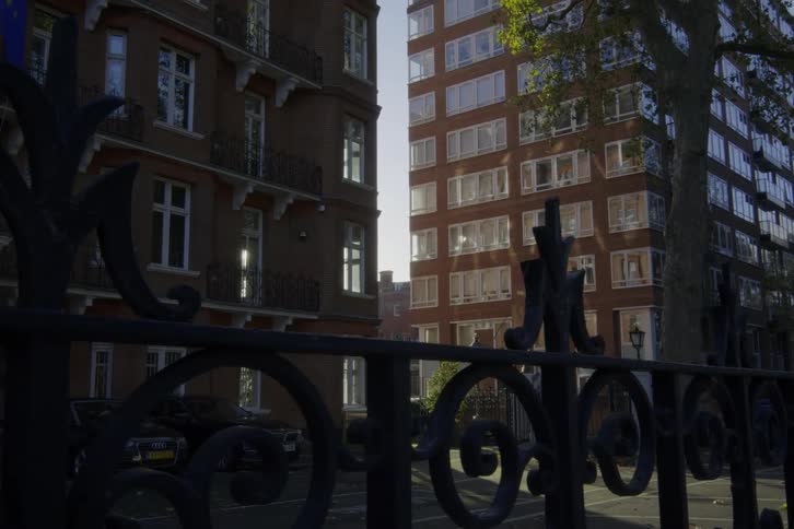 Fence in front of apartment buildings in the city at morning