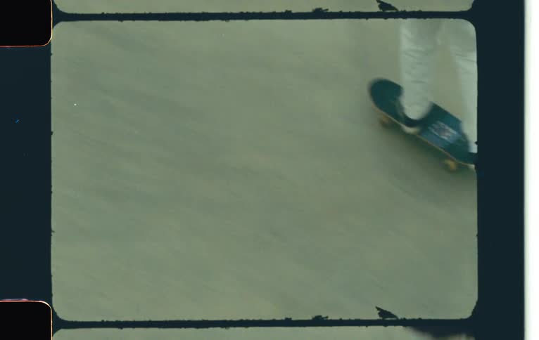 A young boy skateboarding on a rink