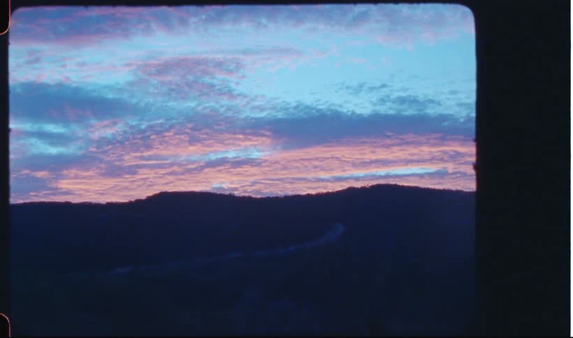 The sun is rising on the mountains