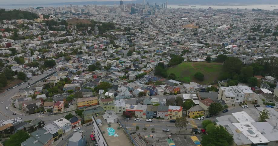 Aerial panorama of a metropolis with residential neighborhoods and skyscrapers on the horizon