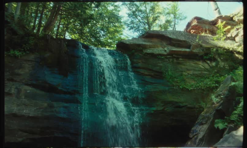 A small waterfall flowing down a rock wall