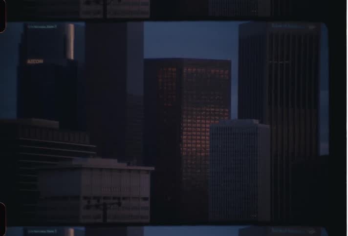 Skyscrapers on the city skyline at morning caught on vintage film
