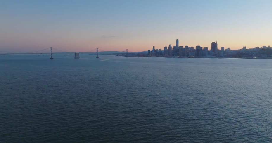 A large city on the water at dawn