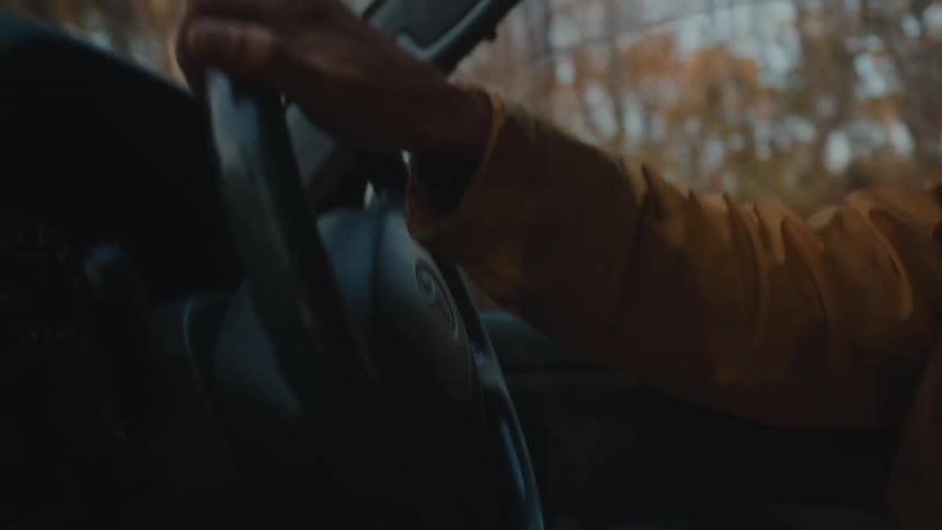 A person driving through the woods