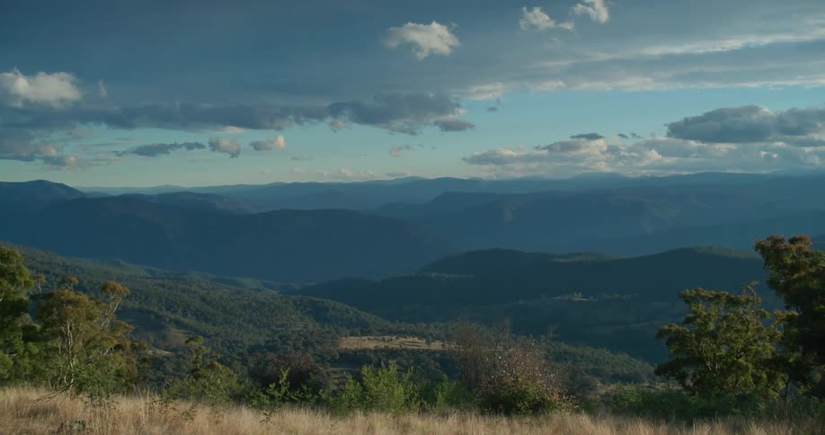 A view of a landscape with hills in the distance