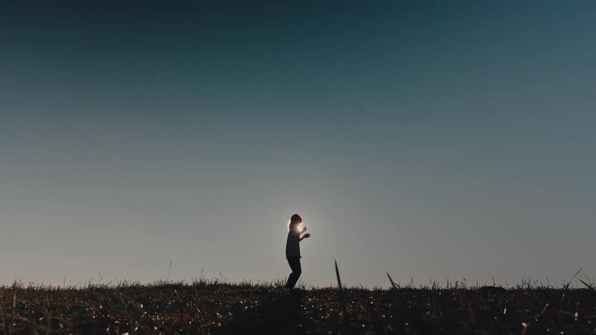 A woman is dancing on the field