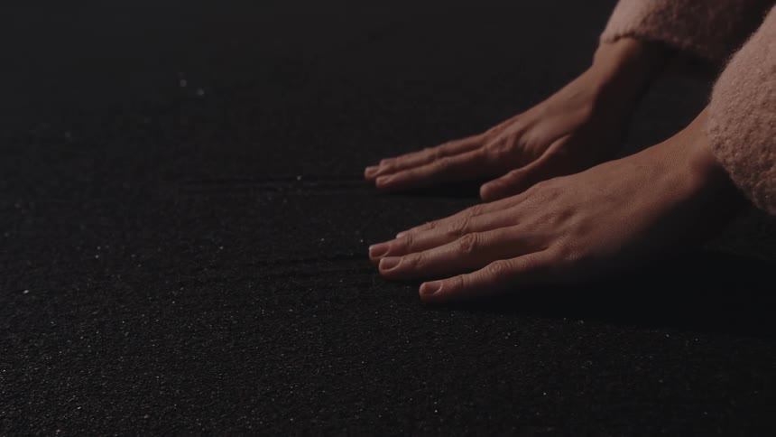 A close up clip of a hand on the floor