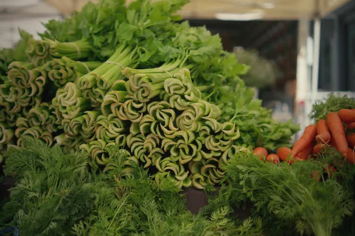 Vegetables including carrot on a table as sample in a market