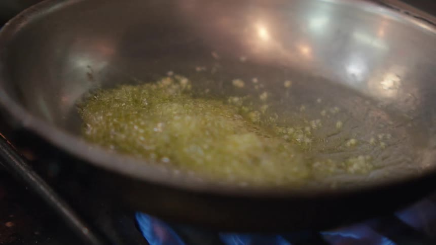 Butter and garlic are cooking in the pan
