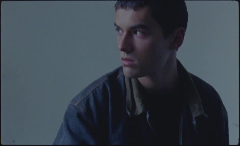 A boy is about to go down a staircase