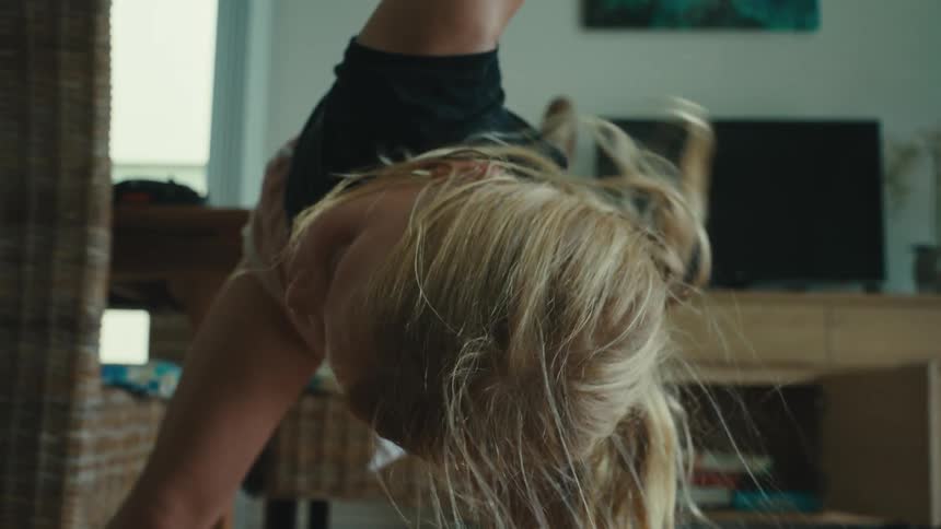 A girl is exercising at home