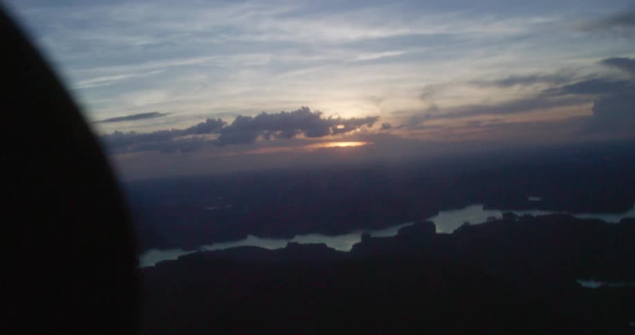 Aerial view of cloudy sky land and water features