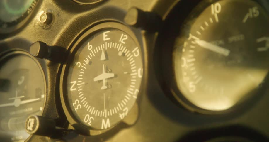 Close up of the gauges on the dashboard of an airplane