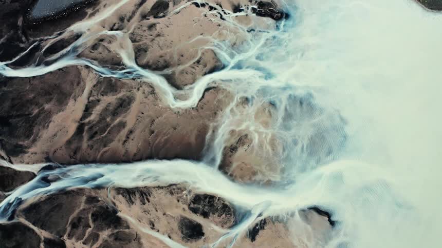 Aerial top view of glacial braided rivers in iceland
