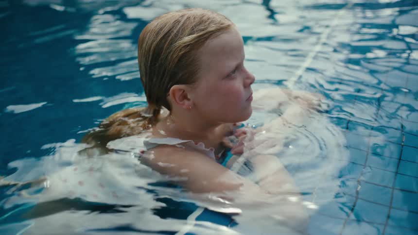 A girl meditating in the pool