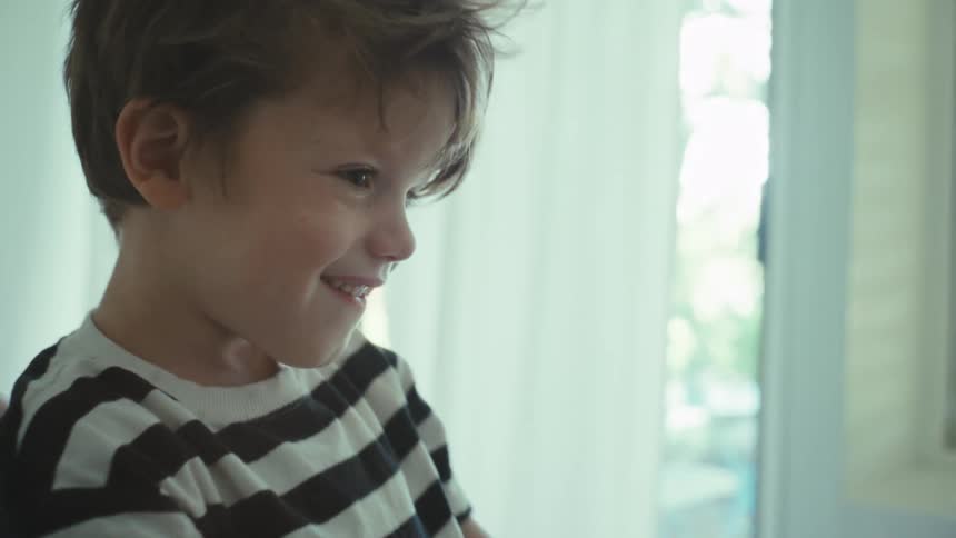 Face of a happy boy listening to his mother